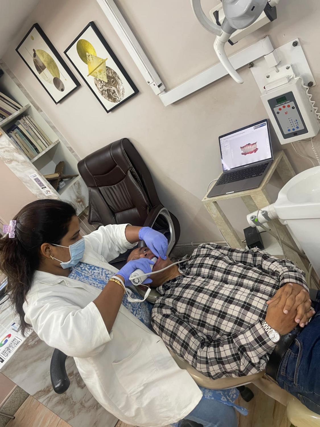 Dr. Haneefa treating a patient at Dental Heal